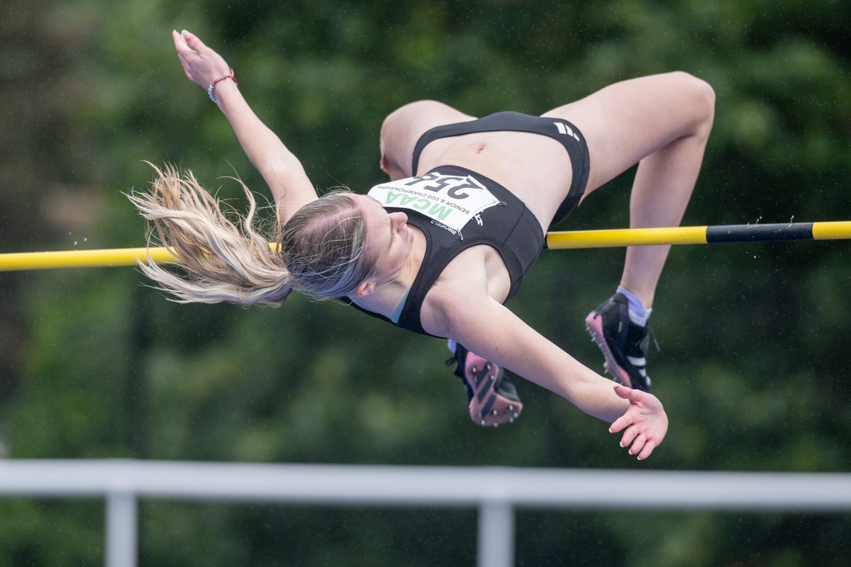 Athlete clearing the bar in a high jump competition